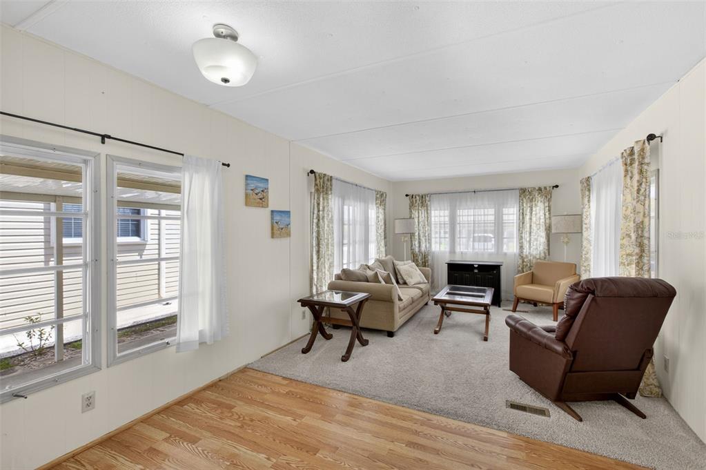 802 Turf Street Venice, FL 34285 - Photo 19 of 50 a living room with furniture and wooden floor