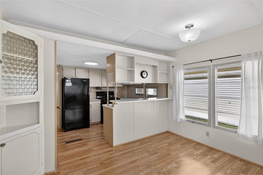 802 Turf Street Venice, FL 34285 - Photo 21 of 50 a kitchen with a refrigerator and a stove