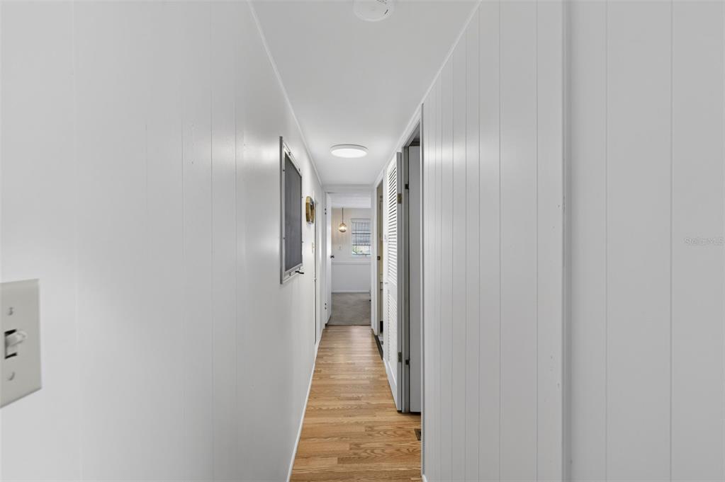 802 Turf Street Venice, FL 34285 - Photo 24 of 50 a view of a hallway with wooden floor