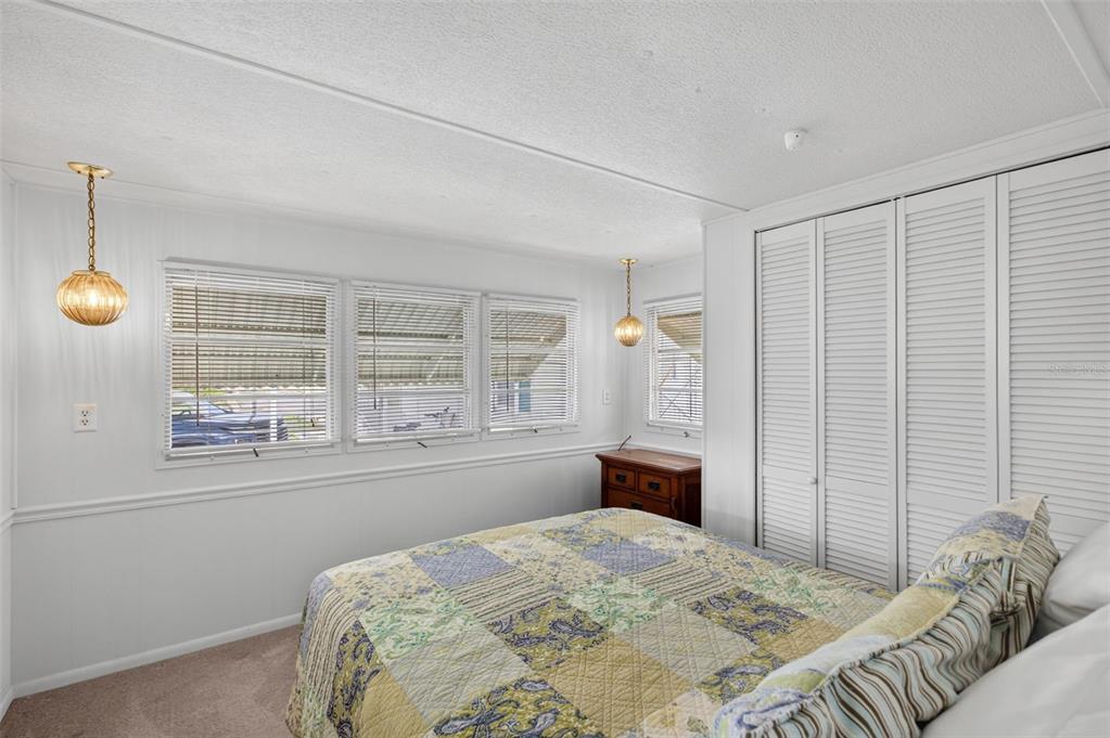 802 Turf Street Venice, FL 34285 - Photo 27 of 50 a bedroom with a large bed and a window