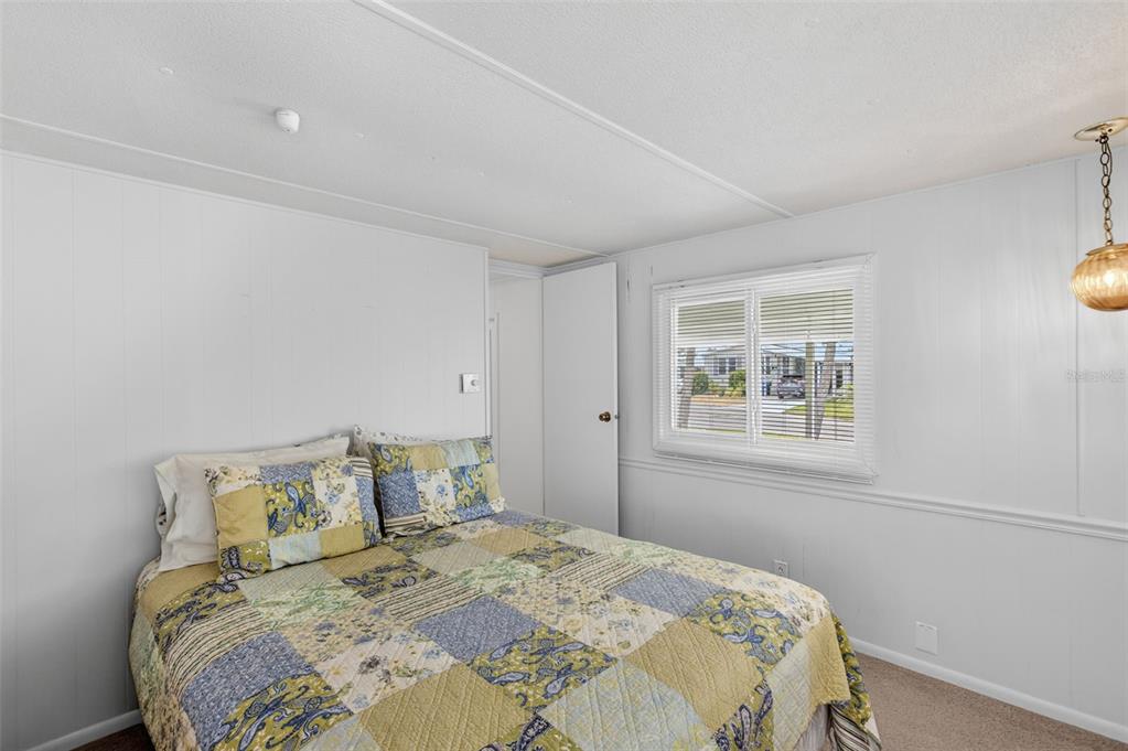 802 Turf Street Venice, FL 34285 - Photo 28 of 50 a bedroom with a bed and a window