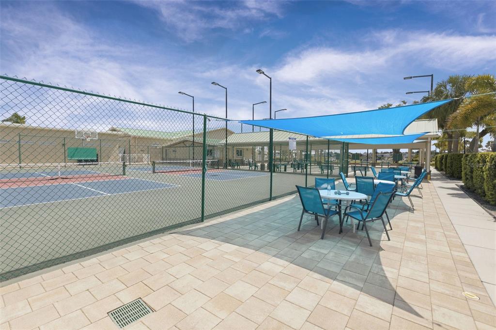 802 Turf Street Venice, FL 34285 - Photo 39 of 50 a view of a patio with a table and chairs under an umbrella