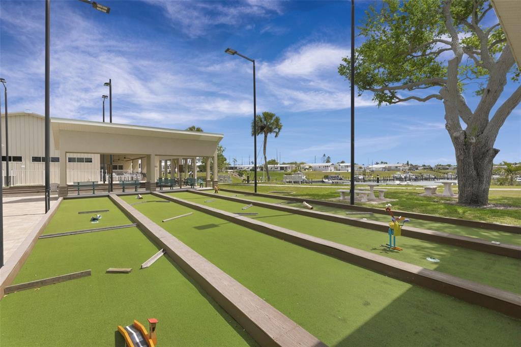 802 Turf Street Venice, FL 34285 - Photo 42 of 50 a view of a swimming pool with a bench
