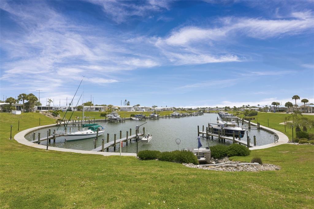 802 Turf Street Venice, FL 34285 - Photo 44 of 50 a view of a lake with a mountain