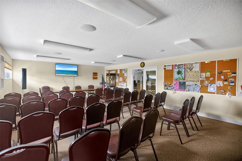 802 Turf Street Venice, FL 34285 - Photo 47 of 50 a room with lots of chairs and wooden floor