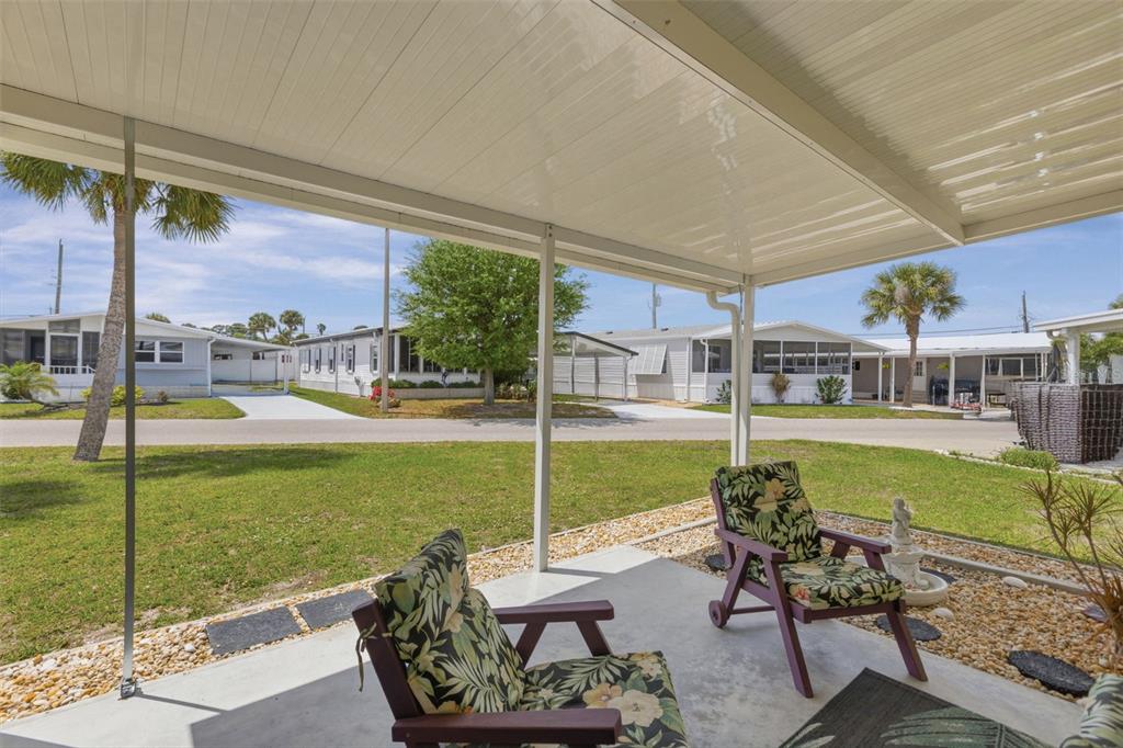 802 Turf Street Venice, FL 34285 - Photo 6 of 50 a view of a patio with chairs and a table