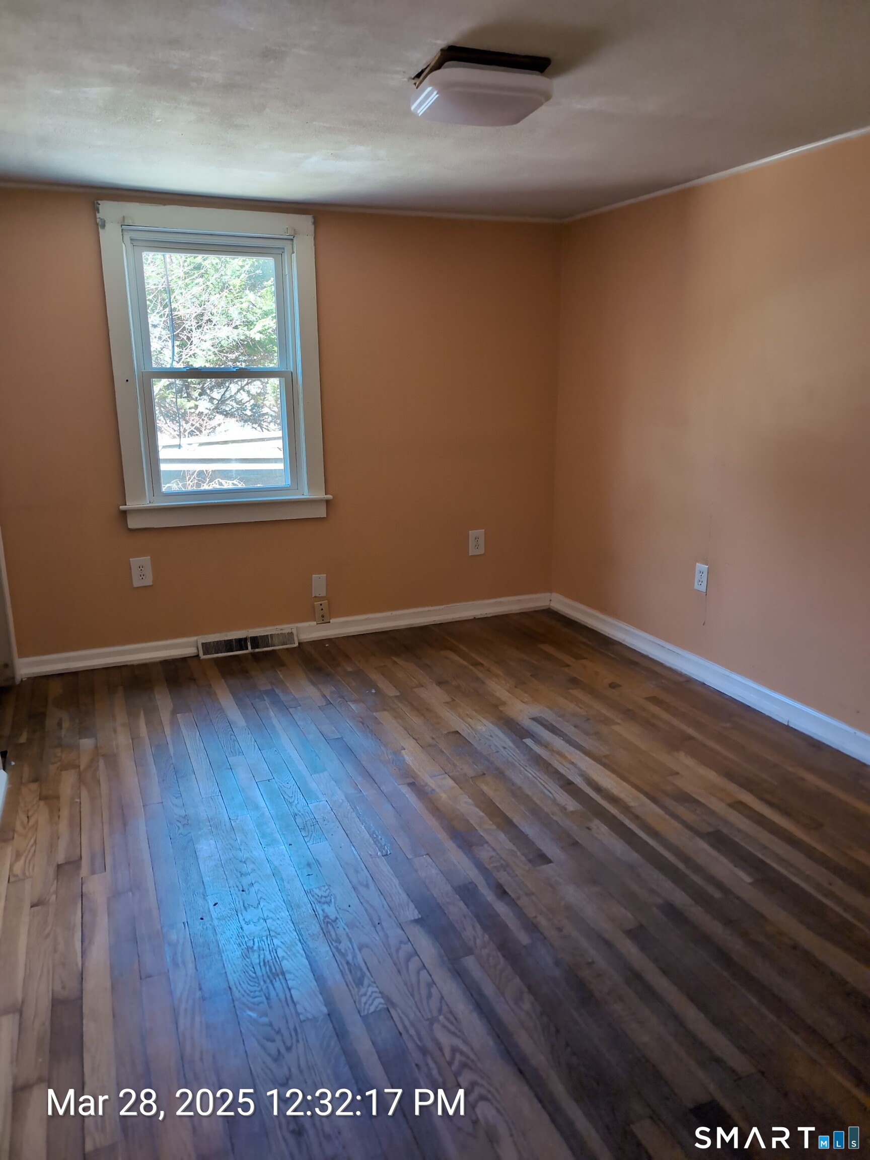 97 Bushy Hill Road Deep River, CT 06417 - Photo 15 of 28 an empty room with wooden floor and windows