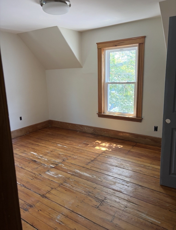 13 Moulton Street Lynn, MA 01905 - Photo 7 of 18 a view of empty room with wooden floor and fan