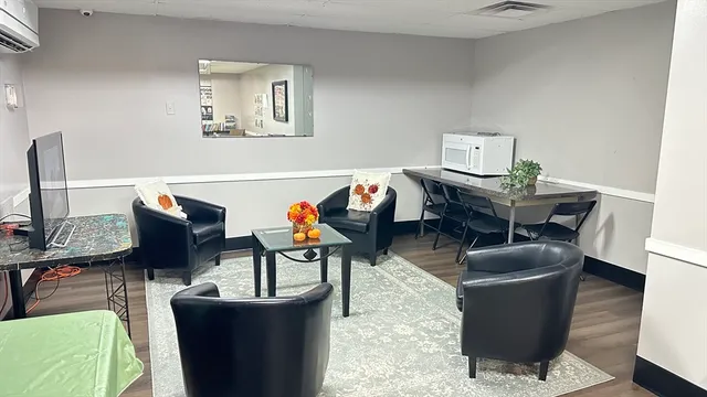 a view of a dining room with furniture window and wooden floor
