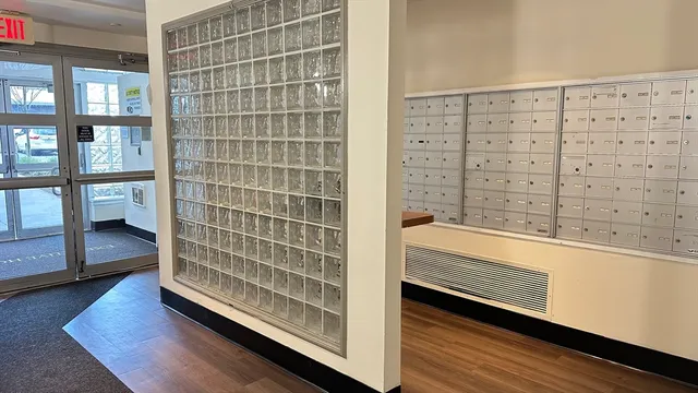 a view of walk in closet and bedroom