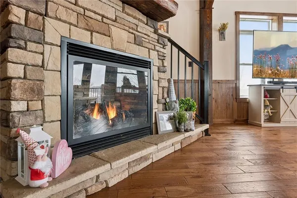 a bedroom with bed and wooden floor