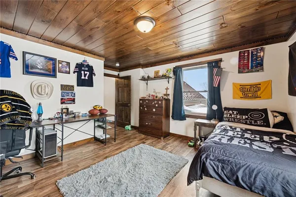 a bedroom with furniture and a window