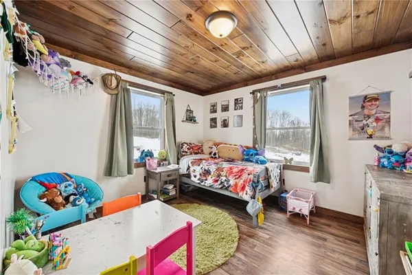 a bed room with furniture and book shelf