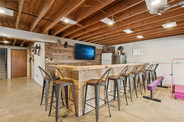 a view of a livingroom with furniture and a ceiling fan