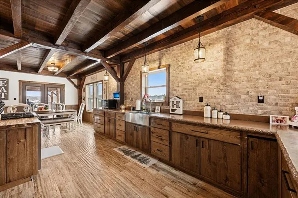 a kitchen with sink a counter and cabinets