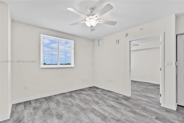 a view of an empty room with a window