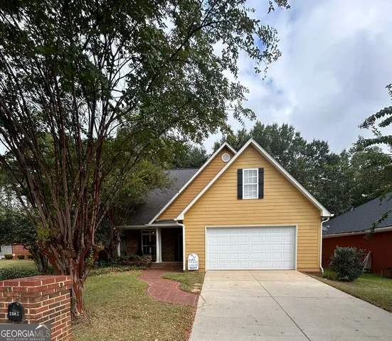 a bathroom with a shower and a sink