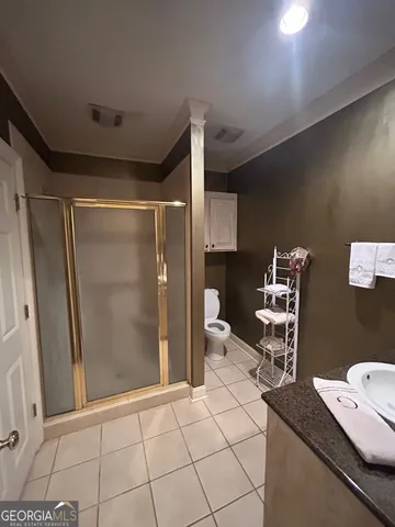 a view of a backyard with plants and flowers