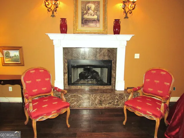 a view of living room with furniture and wooden floor
