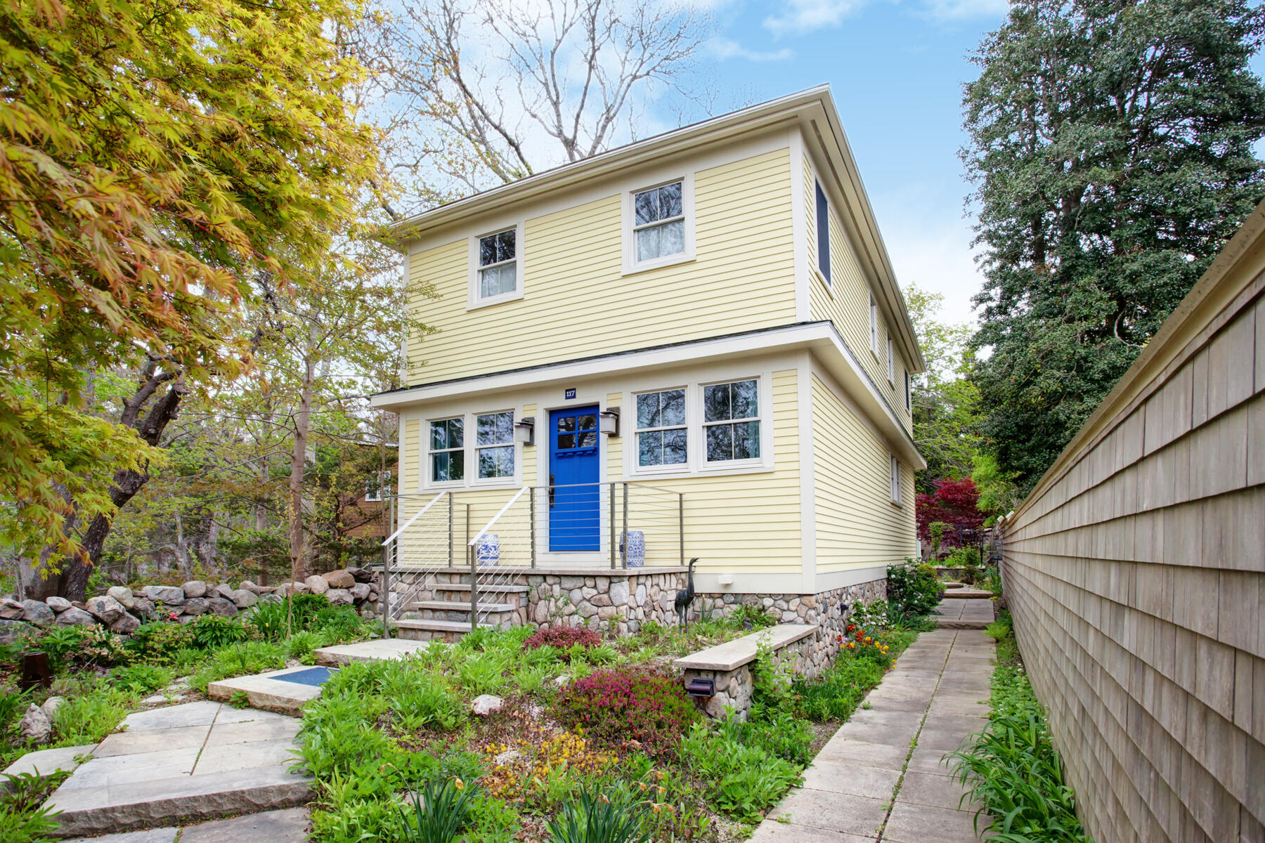 117 Gardiner Road Woods Hole, MA 02543 - Photo 1 of 81 a front view of a house with a yard