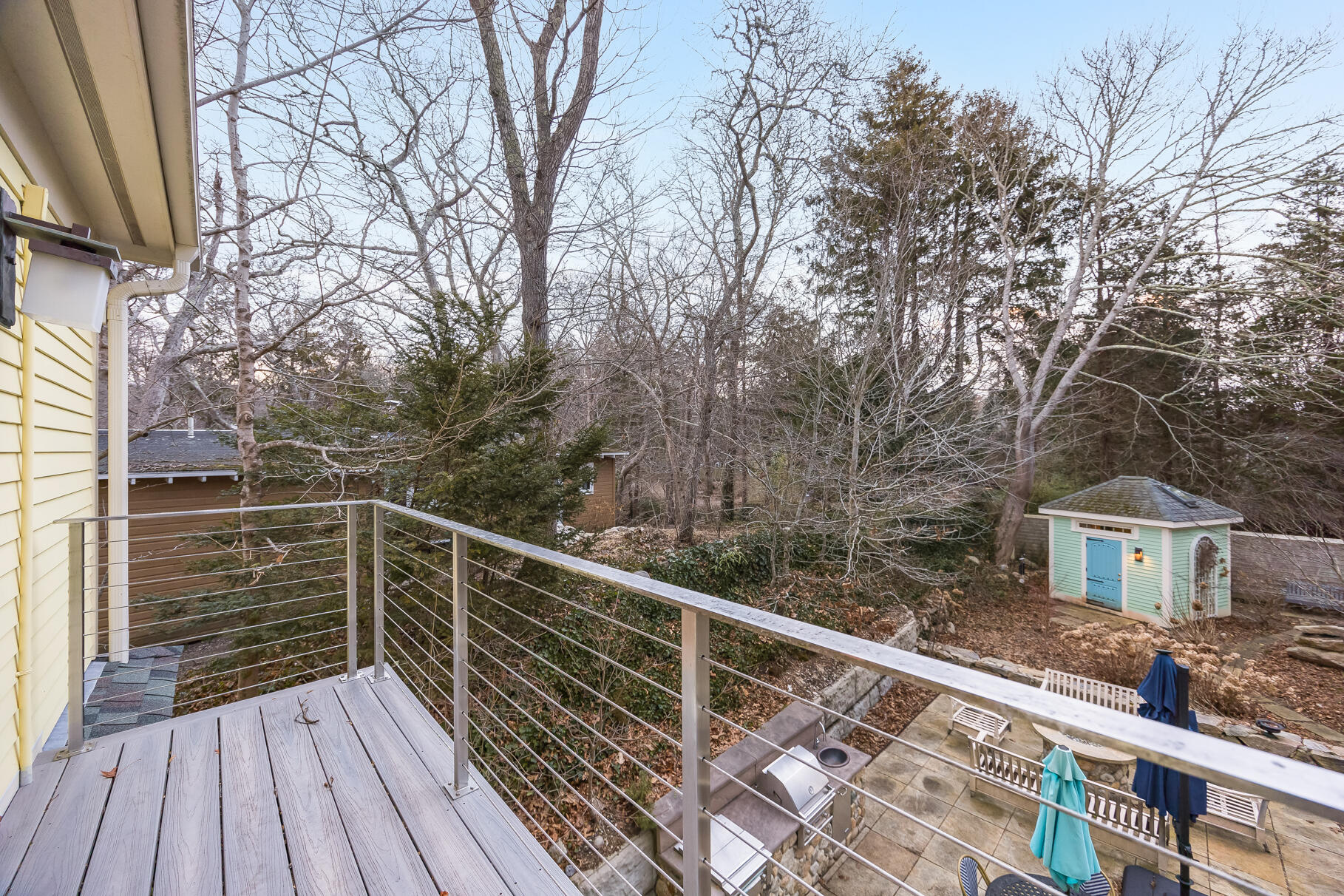 117 Gardiner Road Woods Hole, MA 02543 - Photo 26 of 81 a view of deck and trees with wooden floor and fence