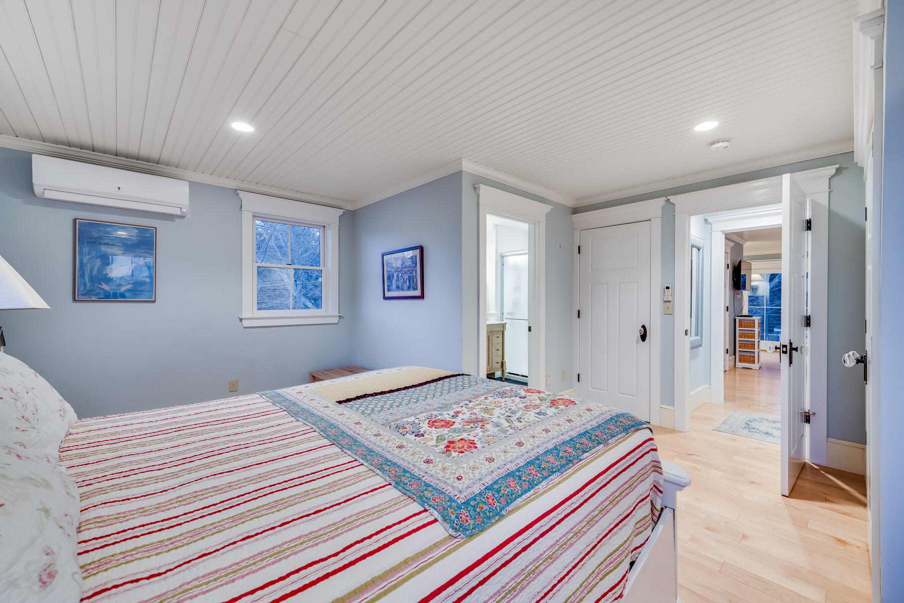 117 Gardiner Road Woods Hole, MA 02543 - Photo 36 of 81 a bedroom with a bed and a table in it