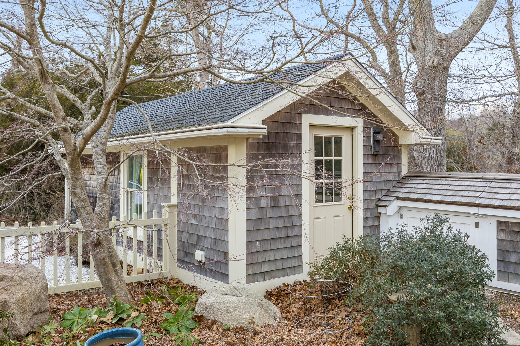 117 Gardiner Road Woods Hole, MA 02543 - Photo 39 of 81 a front view of a house with a garden