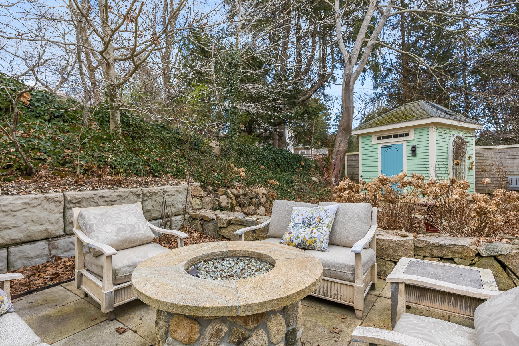 117 Gardiner Road Woods Hole, MA 02543 - Photo 50 of 81 a view of a patio with couches table and chairs and potted plants