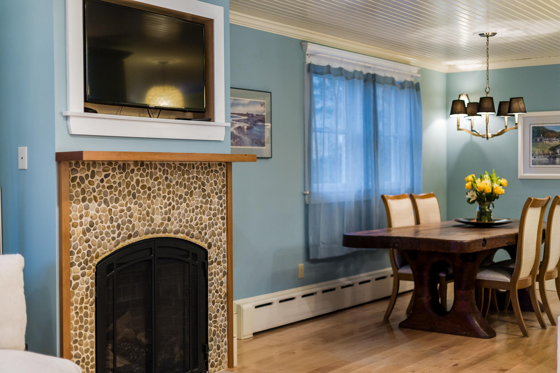 117 Gardiner Road Woods Hole, MA 02543 - Photo 5 of 81 a living room with a wooden floor and a flat screen tv