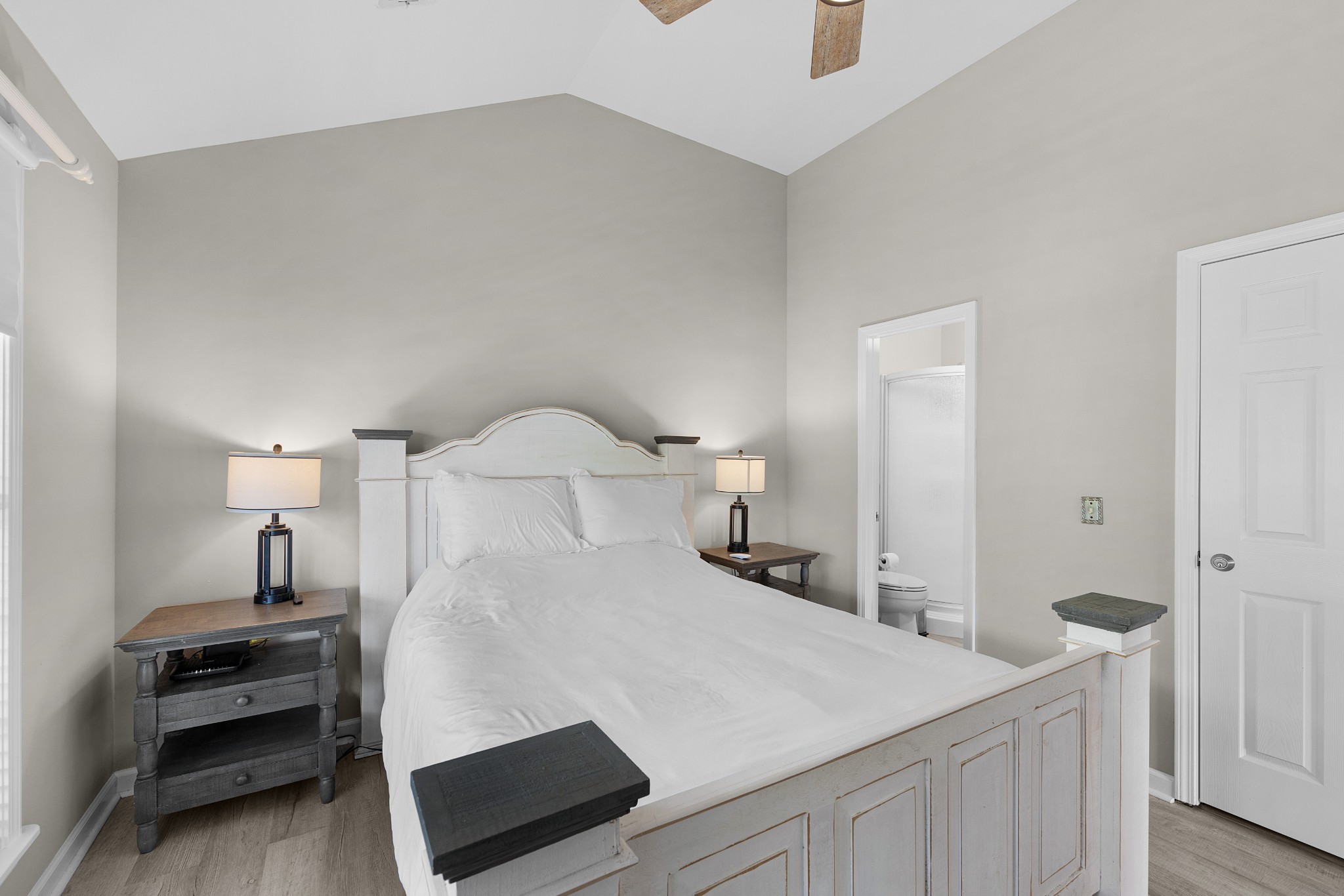 958 Pevahouse Camp Lane Decaturville, TN 38329 - Photo 18 of 32 a bedroom with a bed and a night stand