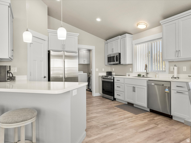 608 Fremont Road Fish Haven, ID 83287 - Photo 15 of 35 Kitchen featuring light gray cabinetry, white countertops, stainless steel appliances, and wood-finish flooring