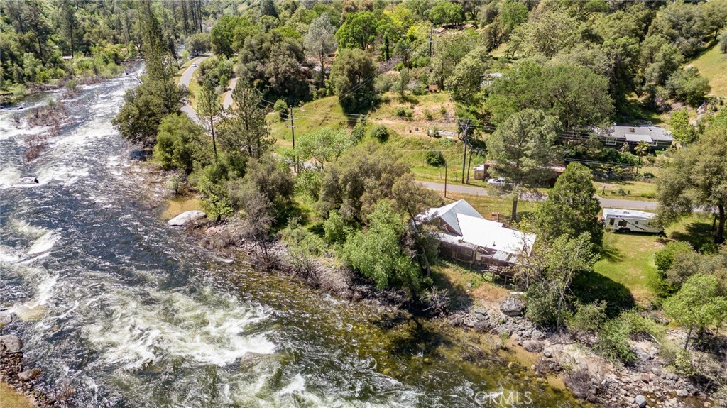 10049 Incline Road El Portal, CA 95318 - Photo 16 of 44 a aerial view of a house with a yard and large trees