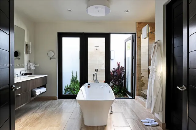 a kitchen with a stove a sink and cabinets