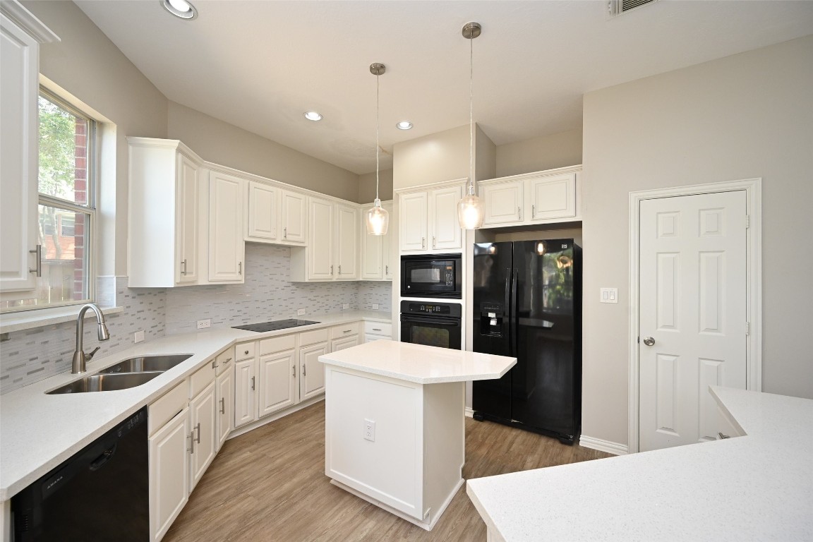 1502 Beaconshire Houston, TX 77077 - Photo 15 of 29 a kitchen with stainless steel appliances a sink stove and refrigerator