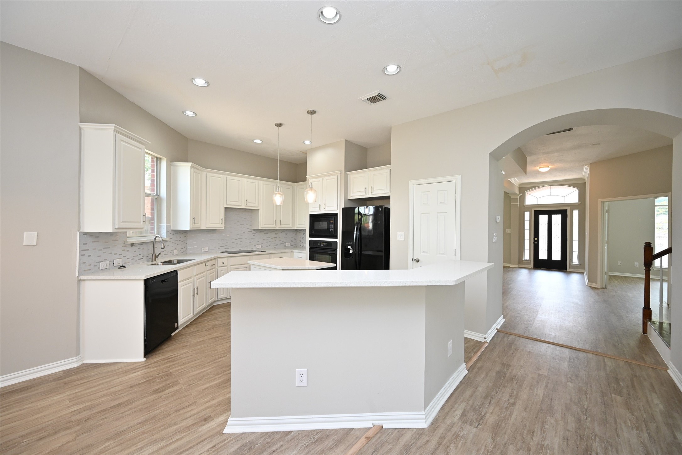 1502 Beaconshire Houston, TX 77077 - Photo 17 of 29 a large kitchen with stainless steel appliances kitchen island granite countertop a stove and a sink