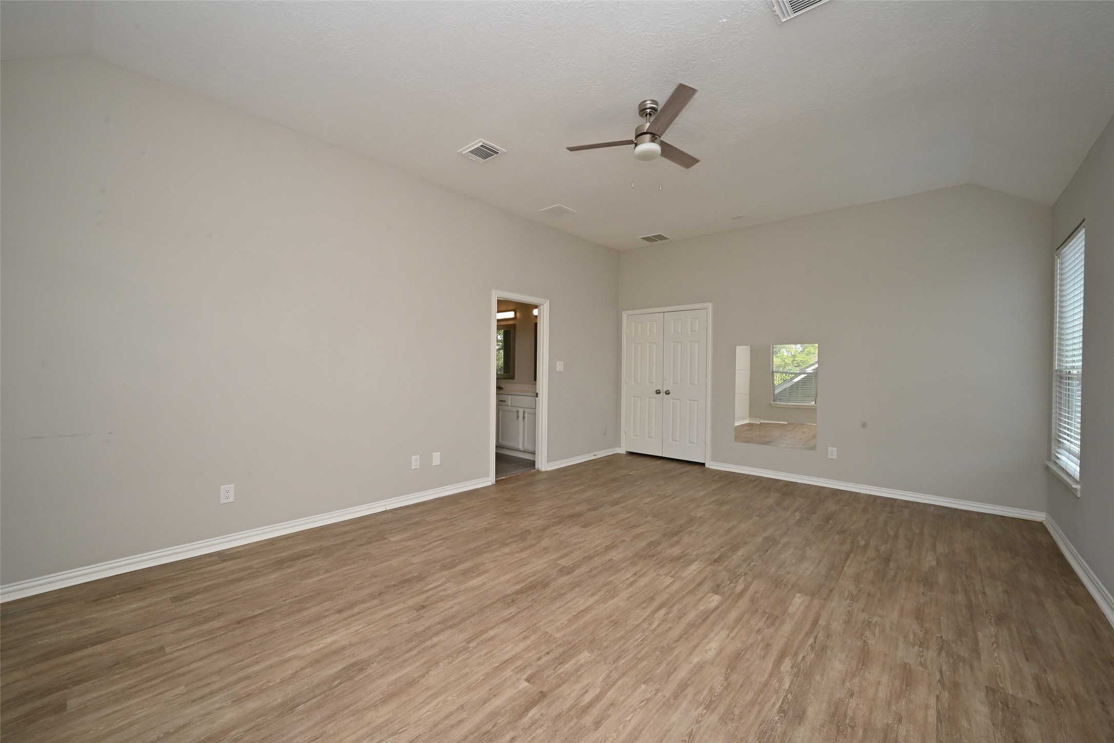 1502 Beaconshire Houston, TX 77077 - Photo 27 of 29 a view of an empty room with wooden floor and a window