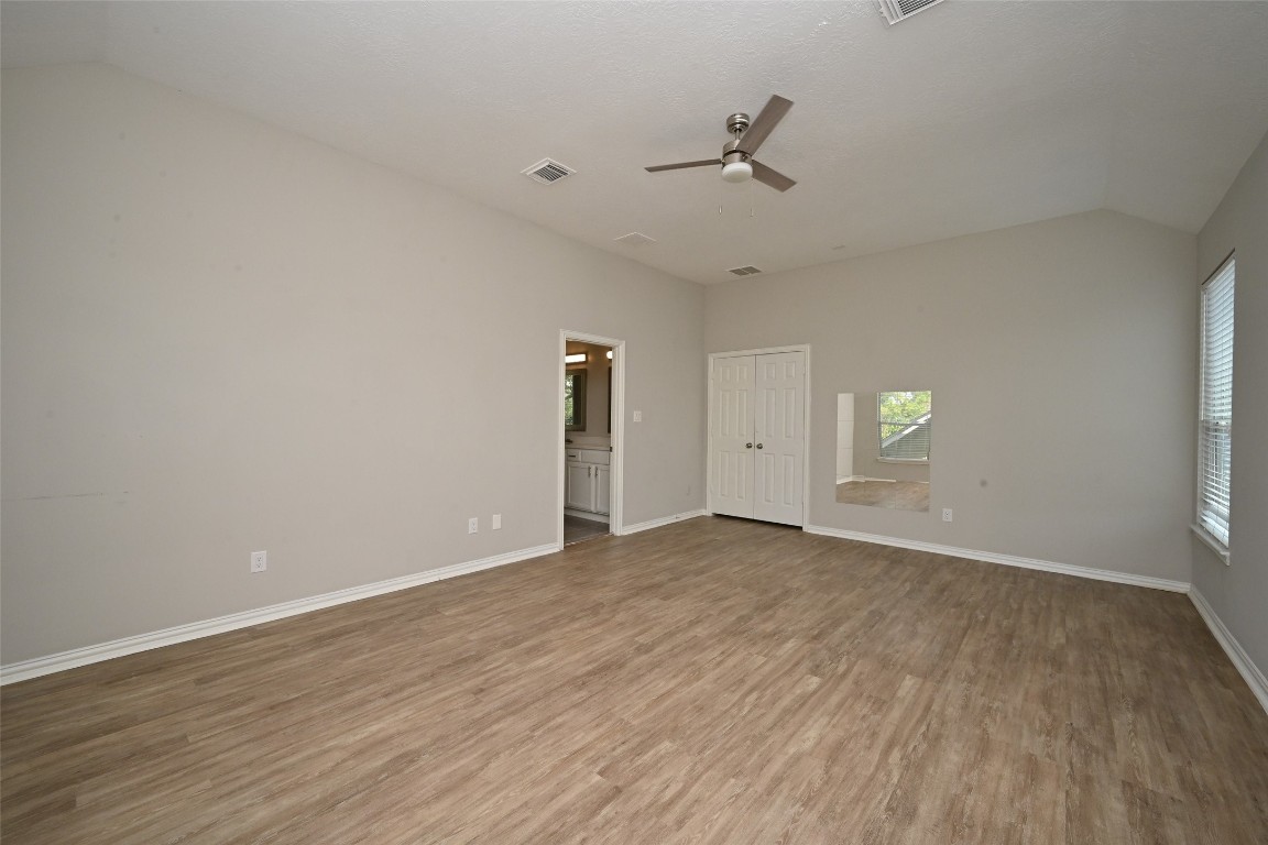 1502 Beaconshire Houston, TX 77077 - Photo 27 of 29 a view of an empty room with wooden floor and a window