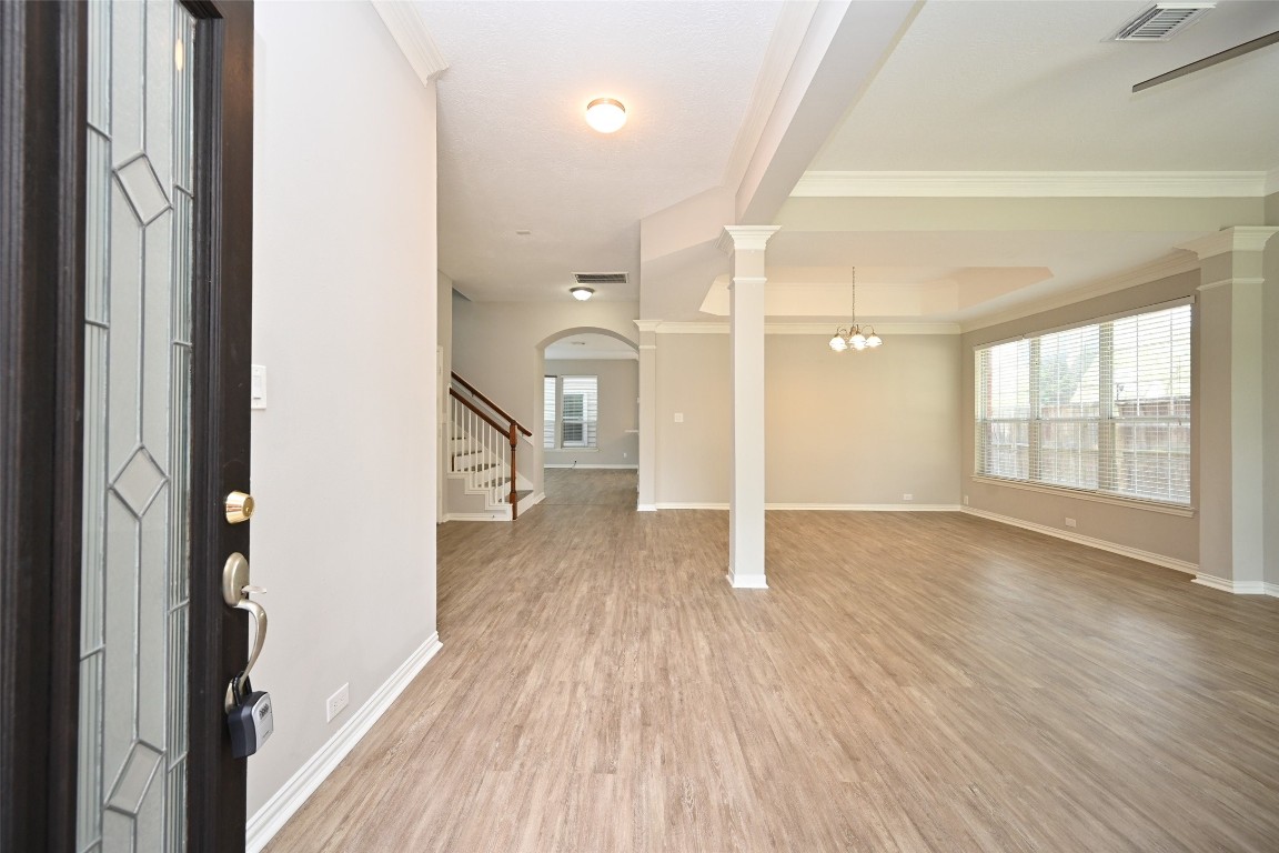 1502 Beaconshire Houston, TX 77077 - Photo 3 of 29 a view of a room with wooden floor and a window