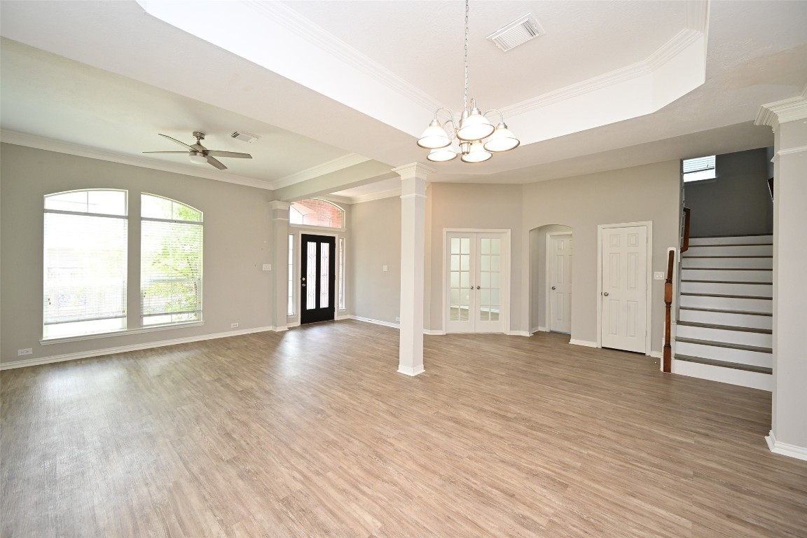 1502 Beaconshire Houston, TX 77077 - Photo 6 of 29 wooden floor in an empty room with a window