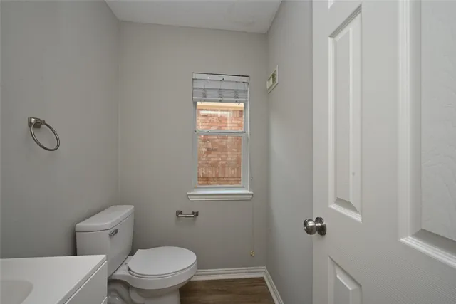 a white toilet sitting next to a bathroom sink