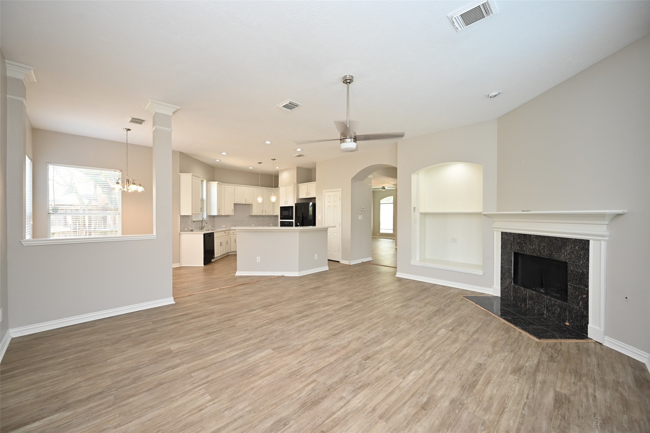 1502 Beaconshire Houston, TX 77077 - Photo 10 of 29 a view of a kitchen with a sink and a fireplace