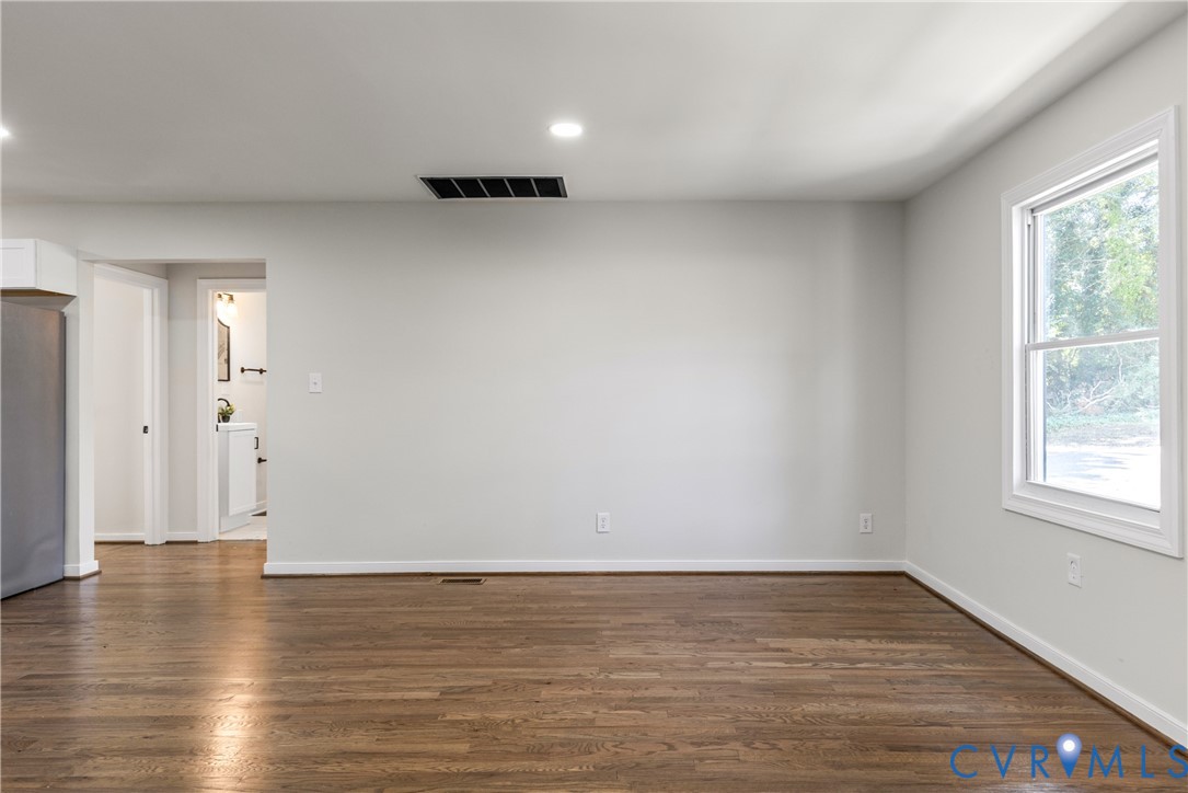 8409 Hopkins Road North Chesterfield, VA 23237 - Photo 5 of 51 Wood-finish flooring with white baseboards, recess