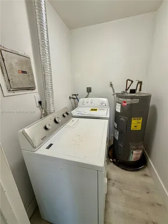 a view of an empty room and wooden floor
