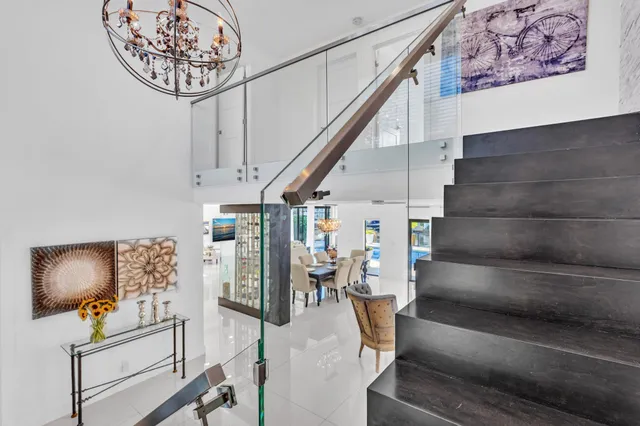 a kitchen with kitchen island granite countertop a sink and cabinets