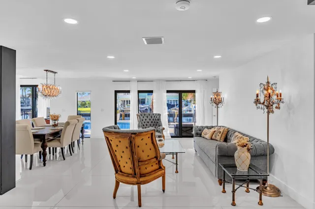 a living room with lots of furniture and a chandelier