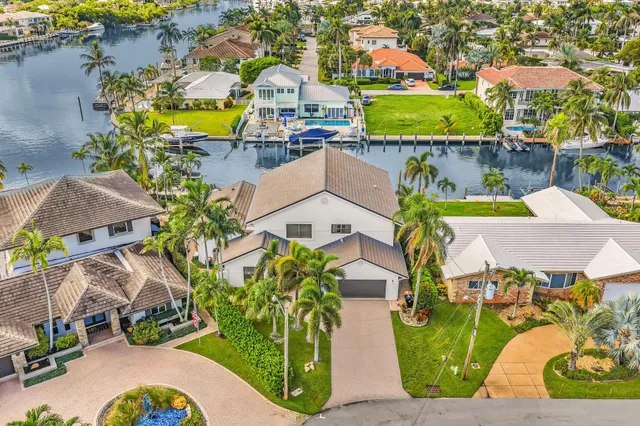an aerial view of a house with a swimming pool