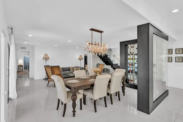 a living room with furniture and large flat screen tv