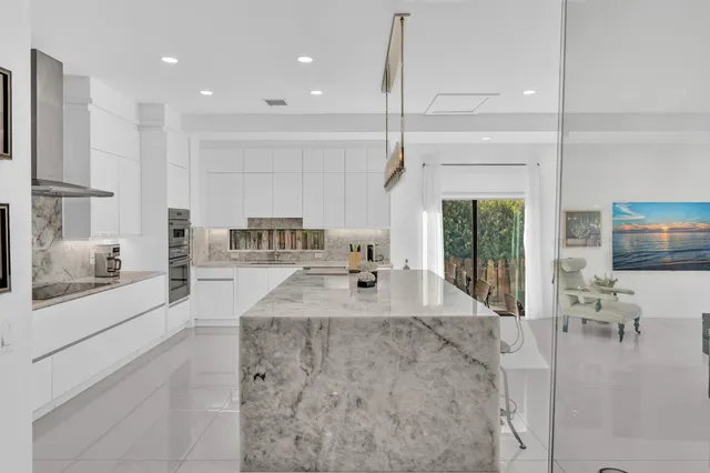 a view of a swimming pool with outdoor seating