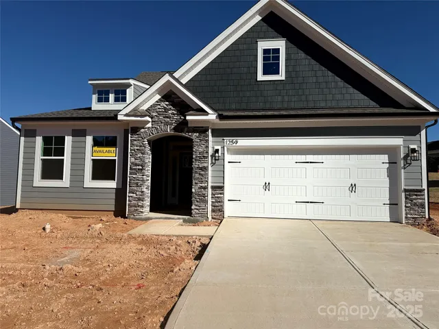 a front view of a house with a garage
