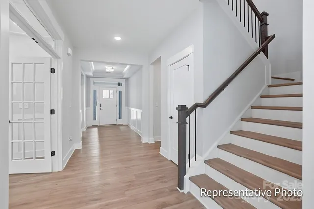 a view of an entryway with wooden floor